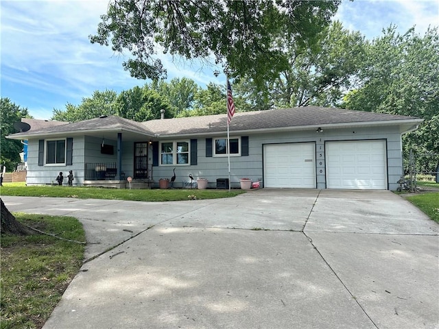 11500 Orchard Rd, Kansas City, MO 64134 - ranch-style house with concrete driveway, an attached garage, and a shingled roof