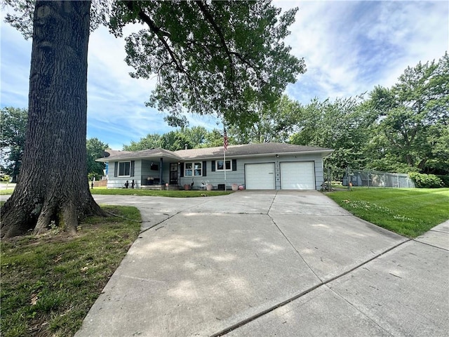 11500 Orchard Rd, Kansas City, MO 64134 - ranch-style house with an attached garage and driveway
