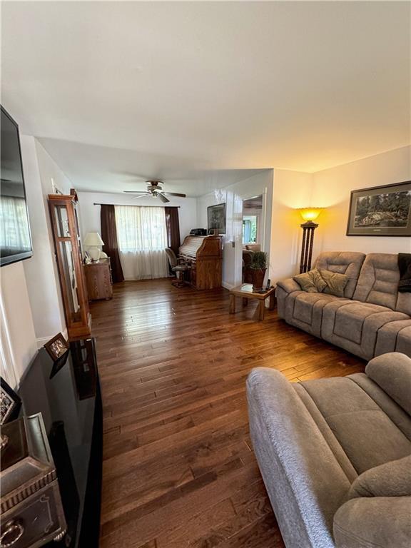 11500 Orchard Rd, Kansas City, MO 64134 - living area with a ceiling fan and wood finished floors