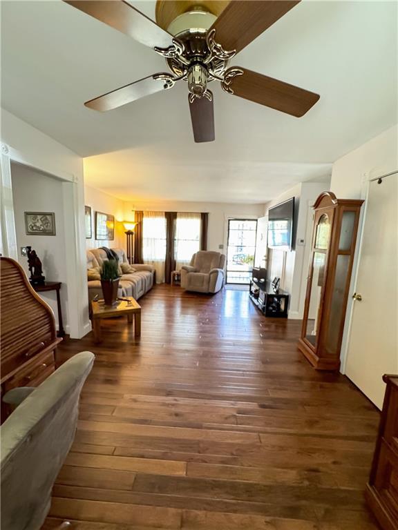 11500 Orchard Rd, Kansas City, MO 64134 - living area featuring a ceiling fan and wood-type flooring