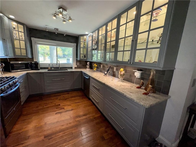 11500 Orchard Rd, Kansas City, MO 64134 - kitchen with stainless steel appliances, a sink, gray cabinets, and tasteful backsplash