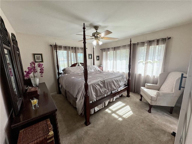 11500 Orchard Rd, Kansas City, MO 64134 - bedroom with light colored carpet and a ceiling fan
