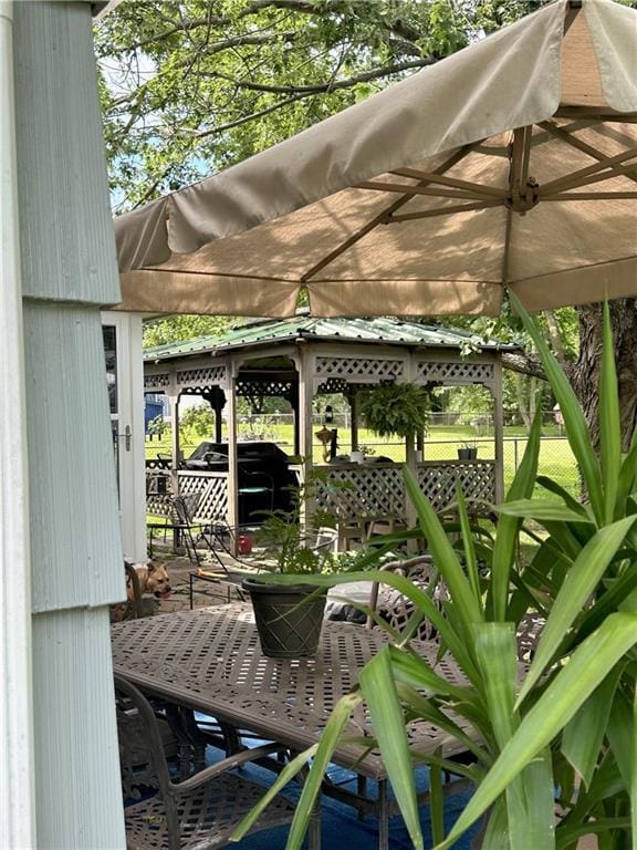11500 Orchard Rd, Kansas City, MO 64134 - deck with a gazebo and outdoor dining area