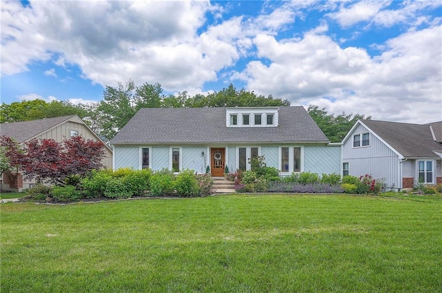 10236 Noland Rd, Lenexa, KS 66215 - view of front of home featuring a front yard and a shingled roof