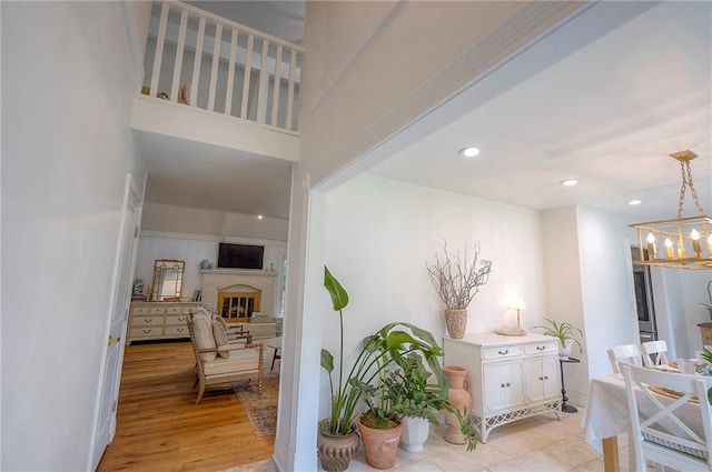 10236 Noland Rd, Lenexa, KS 66215 - corridor featuring a chandelier and recessed lighting