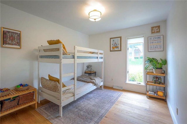 10236 Noland Rd, Lenexa, KS 66215 - bedroom with wood finished floors and baseboards