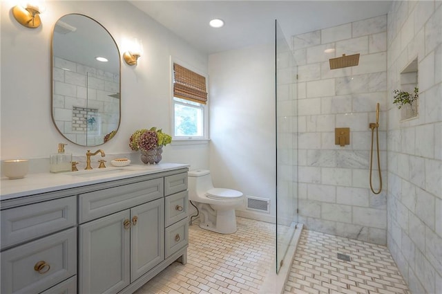 10236 Noland Rd, Lenexa, KS 66215 - full bath with toilet, vanity, tiled shower, tile patterned floors, and recessed lighting