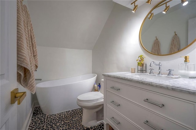 10236 Noland Rd, Lenexa, KS 66215 - full bath featuring a soaking tub, vanity, toilet, and vaulted ceiling