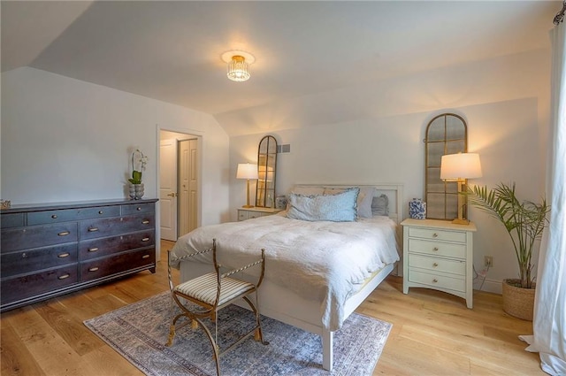 10236 Noland Rd, Lenexa, KS 66215 - bedroom featuring vaulted ceiling and light wood-style floors