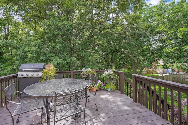10236 Noland Rd, Lenexa, KS 66215 - wooden deck with outdoor dining space and a grill