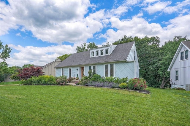 10236 Noland Rd, Lenexa, KS 66215 - view of front facade with a front lawn and roof with shingles