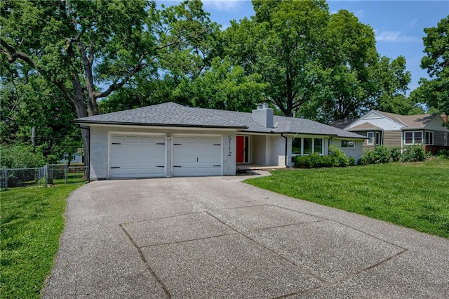 5112 Rock Creek Ln, Mission, KS 66205 - view of front of property with a garage, concrete driveway, and a chimney