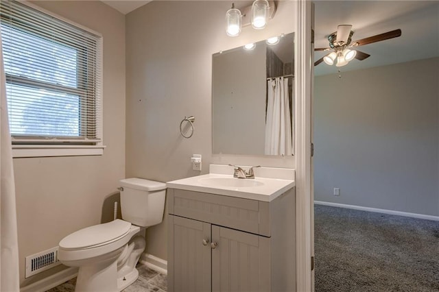 5112 Rock Creek Ln, Mission, KS 66205 - bathroom with a ceiling fan, vanity, toilet, baseboards, and curtained shower
