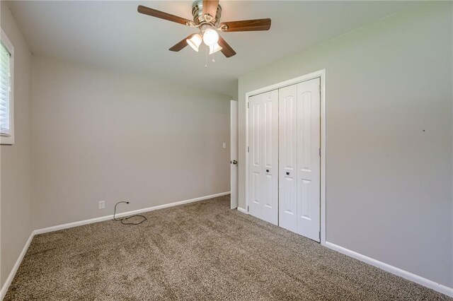 5112 Rock Creek Ln, Mission, KS 66205 - unfurnished bedroom with carpet flooring, baseboards, a closet, and ceiling fan