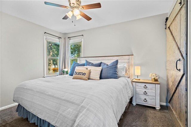5112 Rock Creek Ln, Mission, KS 66205 - bedroom featuring a barn door, dark carpet, baseboards, and ceiling fan