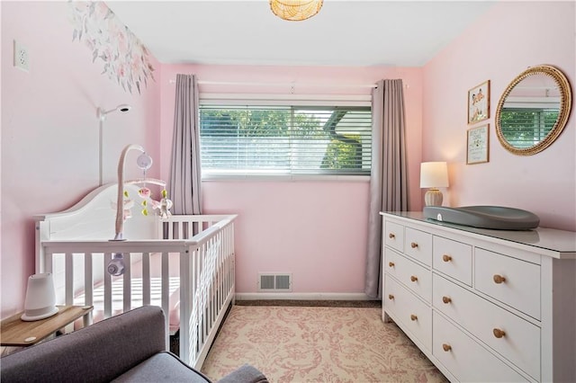 5112 Rock Creek Ln, Mission, KS 66205 - bedroom featuring light colored carpet, a crib, and baseboards