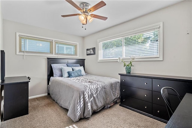 5112 Rock Creek Ln, Mission, KS 66205 - bedroom with light carpet, baseboards, and a ceiling fan