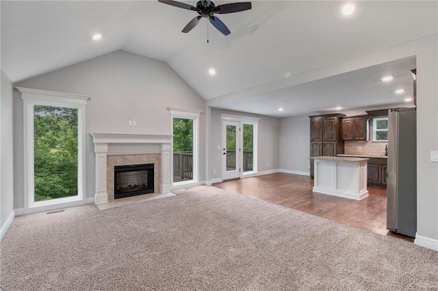 9 Platte Ridge Ct, Edgerton, MO 64444 - unfurnished living room with carpet flooring, recessed lighting, baseboards, a ceiling fan, and plenty of natural light