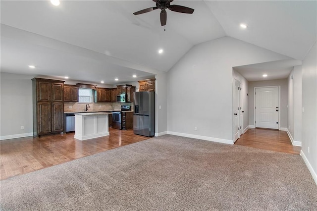 9 Platte Ridge Ct, Edgerton, MO 64444 - kitchen with stainless steel appliances, carpet floors, open floor plan, a sink, and ceiling fan
