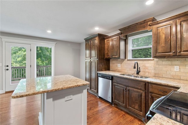 9 Platte Ridge Ct, Edgerton, MO 64444 - kitchen with stainless steel dishwasher, a sink, black range oven, healthy amount of natural light, and recessed lighting