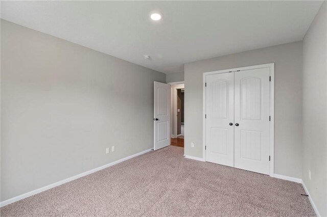 9 Platte Ridge Ct, Edgerton, MO 64444 - unfurnished bedroom with carpet floors, baseboards, a closet, and recessed lighting