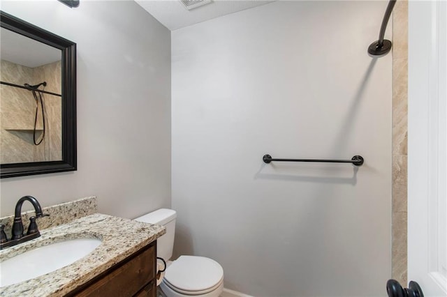 9 Platte Ridge Ct, Edgerton, MO 64444 - bathroom with toilet, vanity, a shower, and baseboards