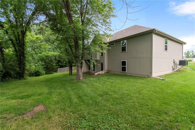 9 Platte Ridge Ct, Edgerton, MO 64444 - back of house featuring central AC unit and a lawn