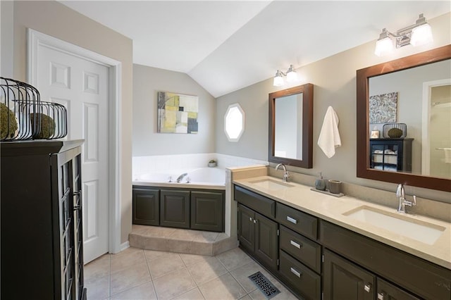 12577 S Alcan Cir, Olathe, KS 66062 - bathroom featuring double vanity, lofted ceiling, tile patterned floors, and a bath