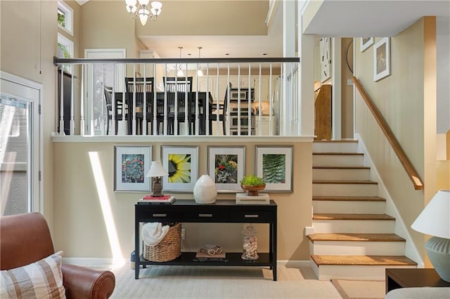 12577 S Alcan Cir, Olathe, KS 66062 - stairs with a high ceiling, carpet floors, and a chandelier