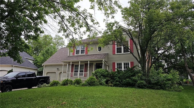 15320 W 92nd Pl, Lenexa, KS 66219 - view of front facade with an attached garage, covered porch, and a front lawn