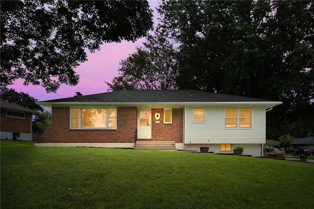 701 N Apache Dr, Independence, MO 64056 - view of front of property featuring a front yard and brick siding