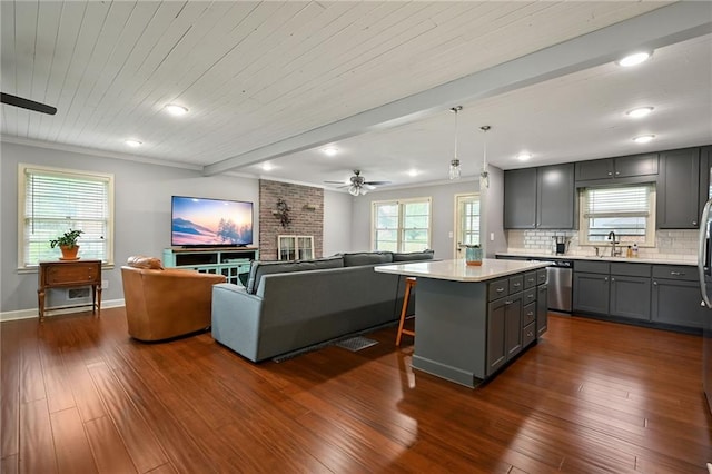 701 N Apache Dr, Independence, MO 64056 - kitchen with gray cabinetry, a sink, open floor plan, stainless steel dishwasher, and recessed lighting
