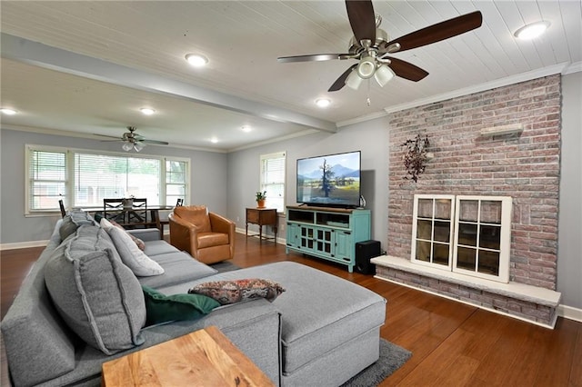 701 N Apache Dr, Independence, MO 64056 - living area featuring ceiling fan, ornamental molding, wood finished floors, baseboards, and a fireplace