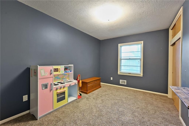 701 N Apache Dr, Independence, MO 64056 - game room featuring a textured ceiling, carpet, and baseboards