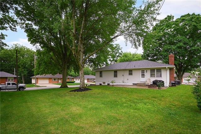 701 N Apache Dr, Independence, MO 64056 - view of green lawn with a patio area