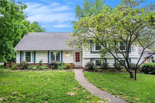 9601 W 97th St, Overland Park, KS 66212 - split level home with a front yard and roof with shingles