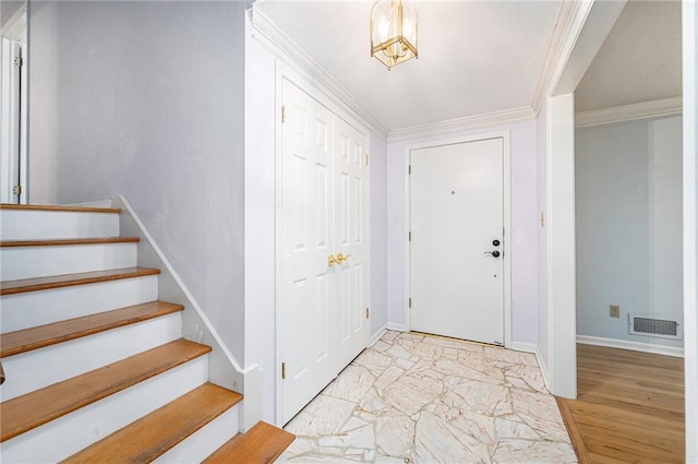 9601 W 97th St, Overland Park, KS 66212 - foyer entrance with baseboards, stairs, ornamental molding, and light marble finish flooring