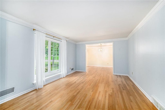 9601 W 97th St, Overland Park, KS 66212 - spare room featuring a chandelier, light wood-type flooring, crown molding, and baseboards