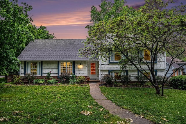 9601 W 97th St, Overland Park, KS 66212 - split level home with a lawn and roof with shingles