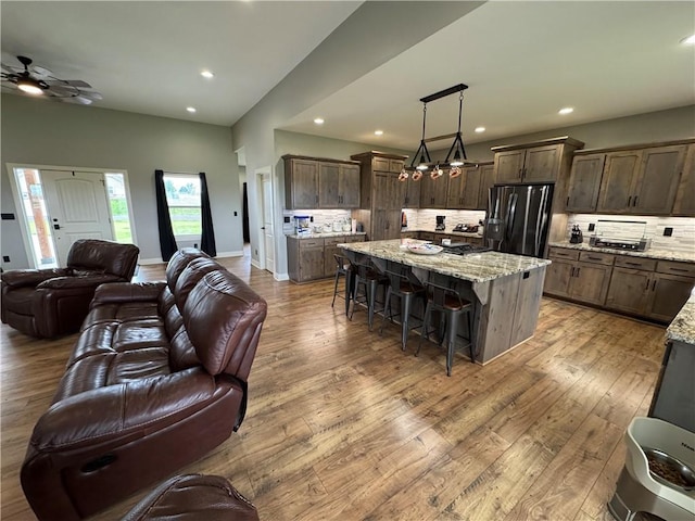 6601 Lakeside Cir, Odessa, MO 64076 - living area with hardwood / wood-style flooring, recessed lighting, and a ceiling fan