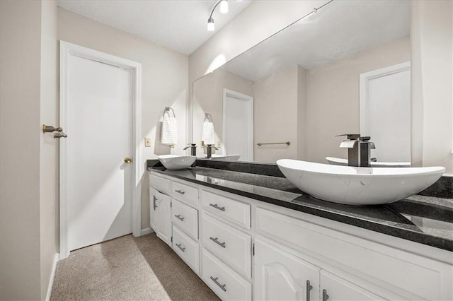 1305 N Hunter Dr, Olathe, KS 66061 - bathroom with double vanity and baseboards