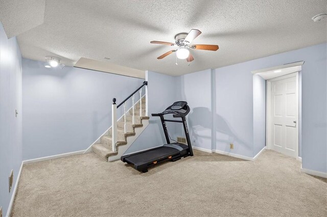 1305 N Hunter Dr, Olathe, KS 66061 - exercise room featuring ceiling fan, carpet floors, and a textured ceiling