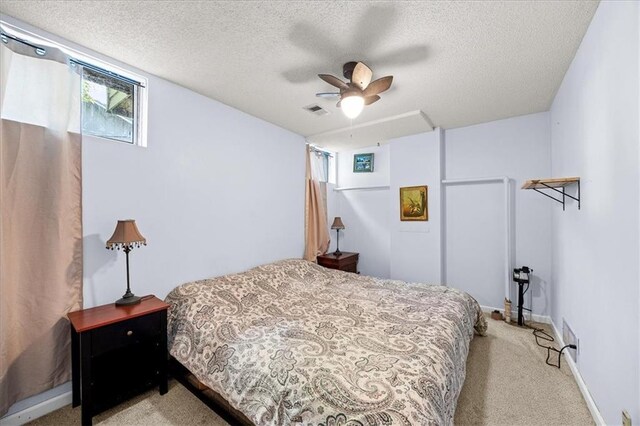 1305 N Hunter Dr, Olathe, KS 66061 - bedroom with light carpet, a textured ceiling, and a ceiling fan