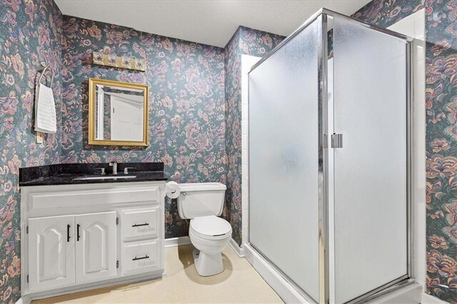 1305 N Hunter Dr, Olathe, KS 66061 - bathroom featuring wallpapered walls, vanity, a stall shower, and tile patterned floors
