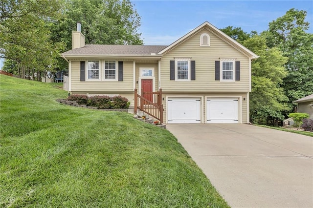 1310 NW 74th Pl, Kansas City, MO 64118 - raised ranch featuring an attached garage, a chimney, driveway, and a front lawn