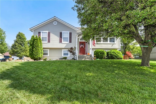 1412 Bradford Dr, Greenwood, MO 64034 - split foyer home featuring a front yard and entry steps