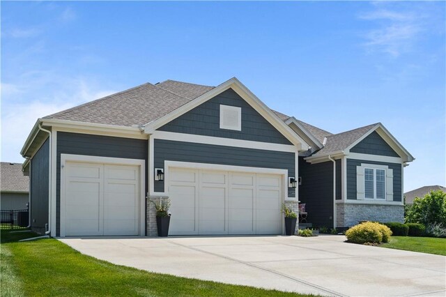 13389 W 147th Ter, Olathe, KS 66062 - craftsman house with an attached garage, concrete driveway, and roof with shingles