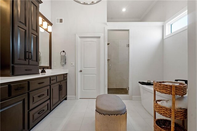 13389 W 147th Ter, Olathe, KS 66062 - full bathroom with a shower stall, vanity, ornamental molding, and a freestanding bath