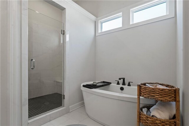 13389 W 147th Ter, Olathe, KS 66062 - bathroom with a stall shower, a freestanding bath, and tile patterned flooring