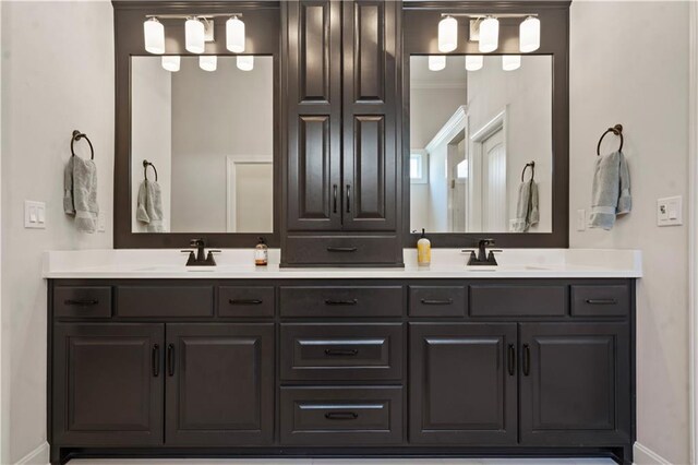 13389 W 147th Ter, Olathe, KS 66062 - bathroom featuring double vanity and ornamental molding